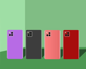 Vier nebeneinander stehende farblich unterschiedliche Smartphones in einem gr&uuml;nen Raum