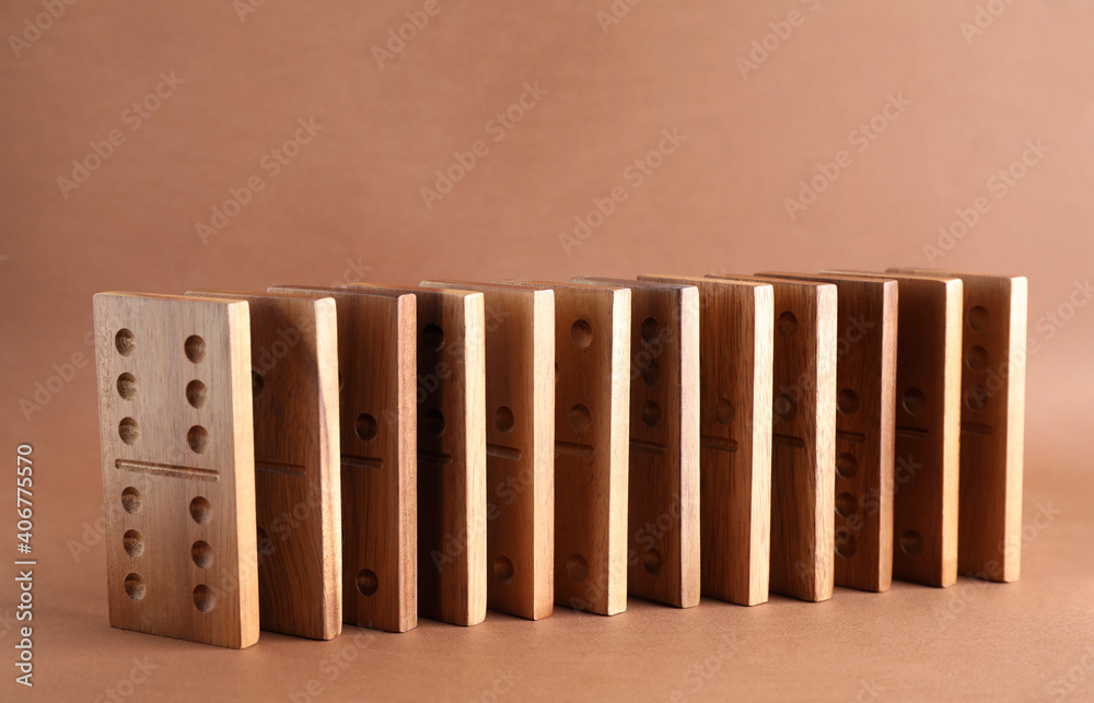 Sticker Wooden domino tiles with pips on brown background