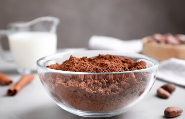 Cocoa powder in bowl on light table
