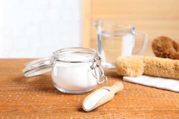 Baking soda on wooden table. Natural detergent