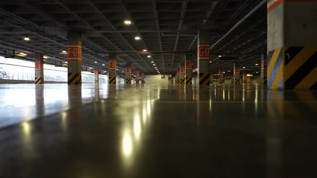 A panning of an empty shopping mall parking lot with no cars