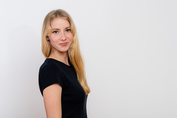 portrait of a young blonde female isolated on a white background