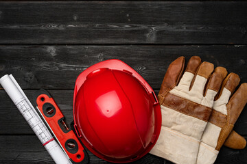 Hardhat and gloves of construction worker top view