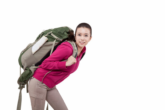 Portrait of a young female carrying backpacker 