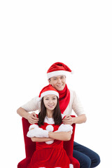 Obraz premium Portrait of young couple wearing Santa hats,smiling