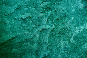 Pop art style viridian green colored rough stone's surface texture