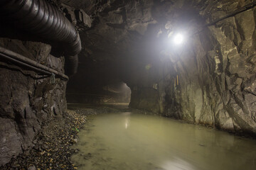 Underground gold mine shaft tunnel drift with light