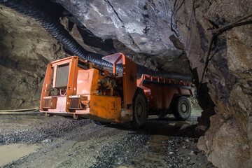 Underground gold ore mine shaft tunnel gallery passage with load, haul, dump machine LHD Toro