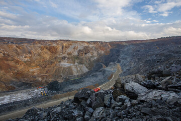 Naklejka premium Working mining drilling machine in gold ore quarry pit