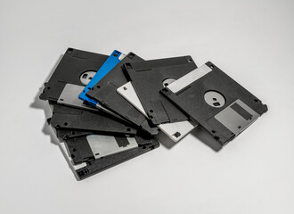 Pile of floppy disks, close-up. Vintage computer technology from 1980s and 1990s.