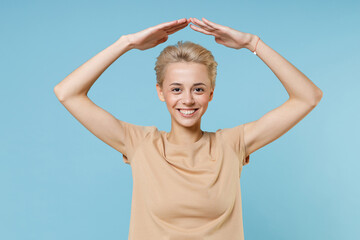 Young nice caucasian blonde smiling woman 20s with short haircut dental braces in casual basic...