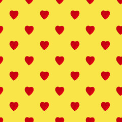 Seamless pattern made of isolated red hearts on yellow background. Top view. Flatlay. Holiday concept. Valentine's Day.