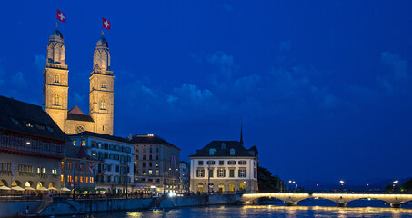Fototapeta na wymiar Iconic view of the Romanesque Grossmunster church in Zurich, Switzerland at night