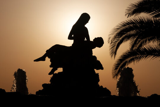 Silhouette of a mermaid saving a sailor, a statue complex at Kini village, Syros island, Greece, which symbolize the care for the island's sailors. 
