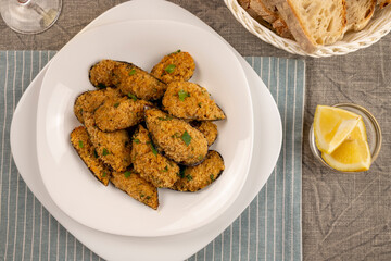 Gratin mussels. Italian finger food. Seafood appetizer of typical Italian cuisine. Sea snacks. Flat lay.