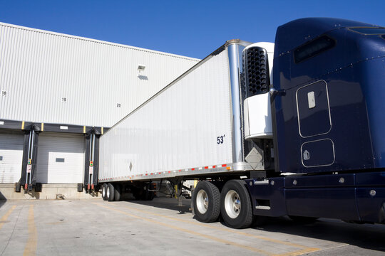 Blue Tranport Truck Docking in warehouse