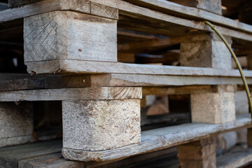Old wooden stacked euro pallets