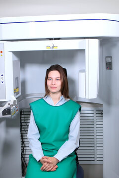 A girl in a protective vest in an x-ray office in a dental clinic. Rengen equipment in the clinic. Healthcare Concept.