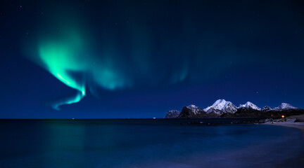 Fototapeta na wymiar Aurora Polaris on sky in Lofoten islands