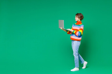 Full length side view of smiling funny young brunette woman 20s years old wearing basic casual...