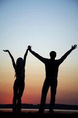 Fototapeta premium silhouette of young couple