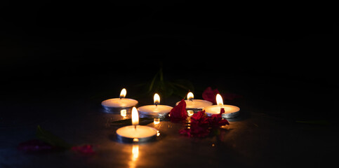 candle on water with Reflections_ flowers and Plant
