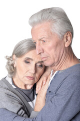Portrait of sad senior couple isolated on white background