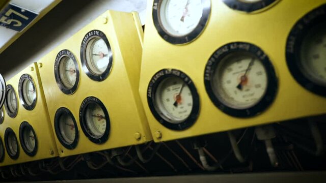 Submarine control panel. Pressure gauges located on the yellow panel above