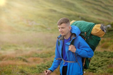 Naklejka premium Hiker on the top in Carpathians mountains. Travel sport lifestyle concept