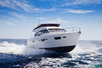 Fototapeta na wymiar fast motor yacht in navigation