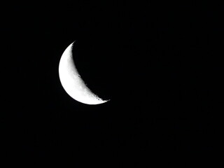 Obraz na płótnie Canvas Moon in the night sky. Moon on a dark background.