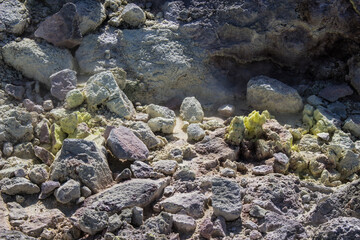 Close up photo of a rocky area where sulfur crystallized