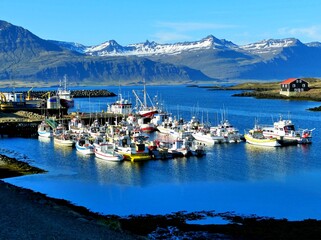 Obraz premium Iceland Djupivogur cruise port, Boats, ships, nautical vessel in harbor. Icelandic fishing village located in stunning surroundings East Fjords. Peaceful landscape, idyllic northern nature.