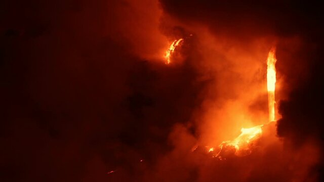 Hawaii Volcano eruption - flowing lava reaches ocean on volcanic eruption on Big Island, Hawaii. Lava stream flowing from Puu Oo, Kilauea volcano by Hawaii volcanoes national park, USA. 59.94 FPS