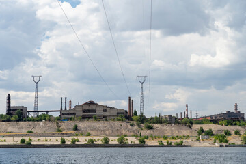 Obraz premium Volgograd, Russia, July 22, 2020, Volgograd Krasnooktyabrsky district red October combine tractor plant factory pipes