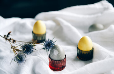 Organic naturally dyed yellow and gray Easter eggs.