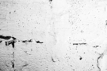 Texture of a concrete wall with cracks and scratches which can be used as a background