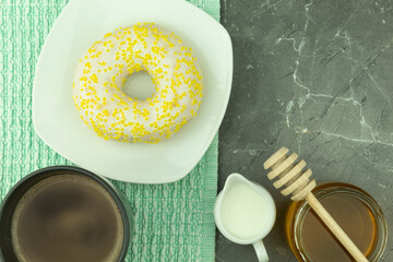 Fresh and crispy donut and coffee with milk