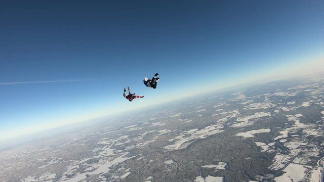 Skydiving. Fun jump. Two skydivers are having fun in the sky.