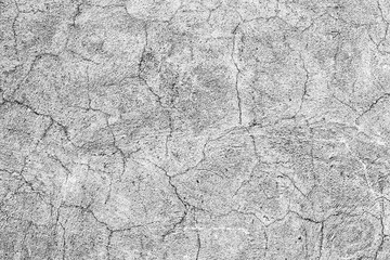 Texture of a concrete wall with cracks and scratches which can be used as a background