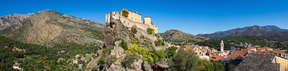 Fototapeta na wymiar The mountains Punta di Zurmulu, Capo Nero, Punta Finosa, Capizzolo and the citadel of Corte, Corsica, France.