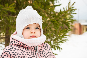 a child on a walk in winter snow weather