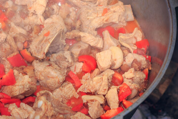 Cooking Bograch in a cauldron