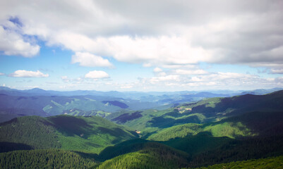 Fototapeta na wymiar View of green mountain plains and mountains
