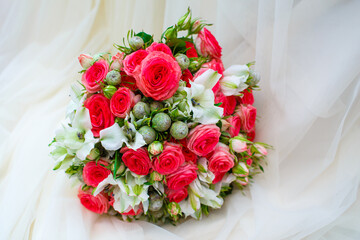 Bridal bouquet of red roses and white flowers. Selective focus