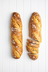 Crispy fresh baguettes. Sliced baguette.