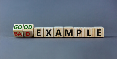 Good or bad example symbol. Turned cubes and changed words 'bad example' to 'good example'. Beautiful grey background. Business and bad or good example concept. Copy space.