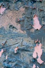 Rough textured blue wall with stains, selective focus