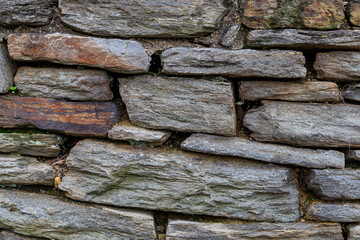 Pattern of stone wall surface.Texture of a stone wall, Stone fence gray background.