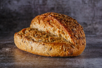 Assortment of baked bread on wooden table background Fresh fragrant bread on the table. Food concept.